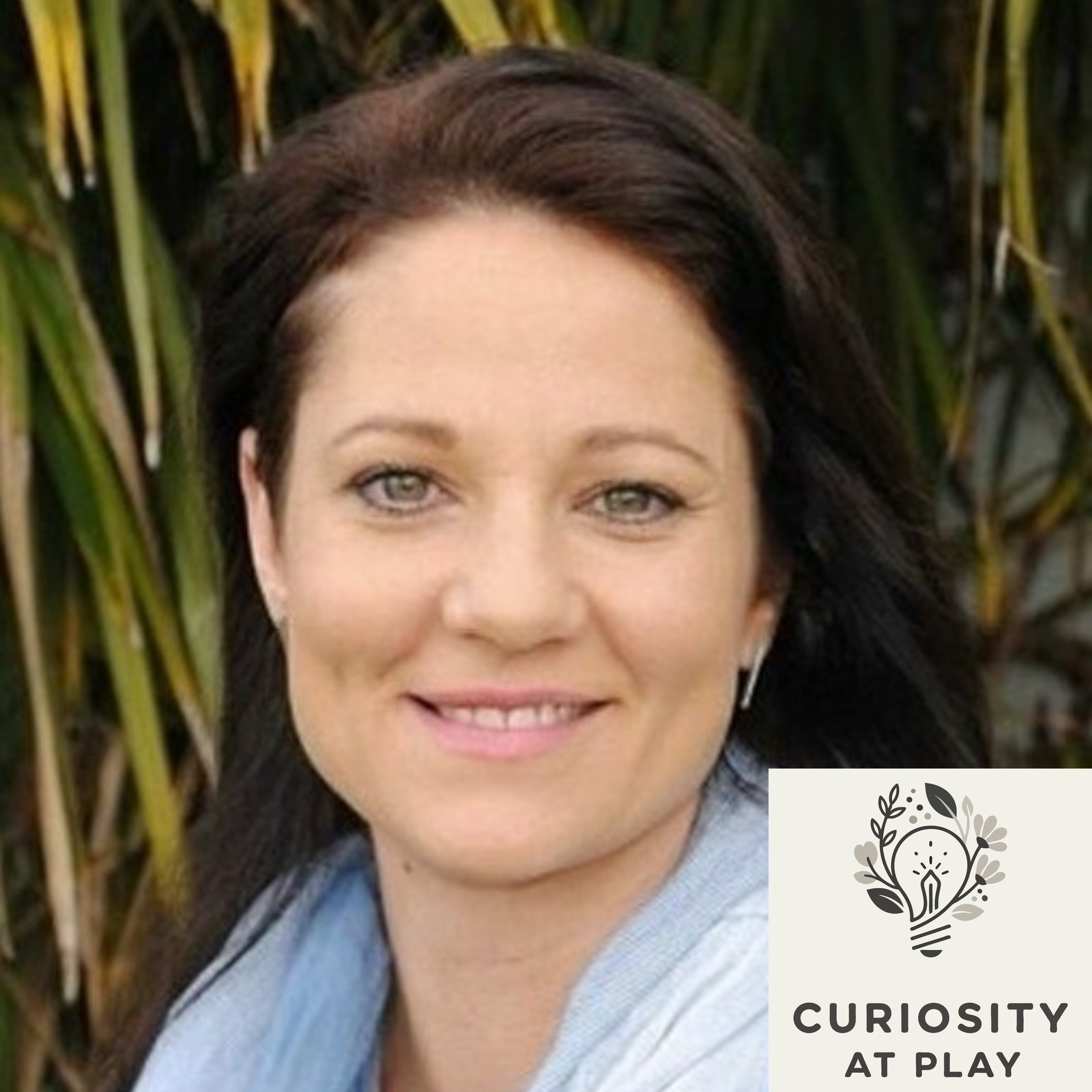 Smiling woman with dark hair and green eyes, featuring the Curiosity at Play logo.